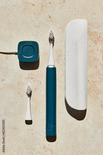 Blue electric toothbrush with accessories photo