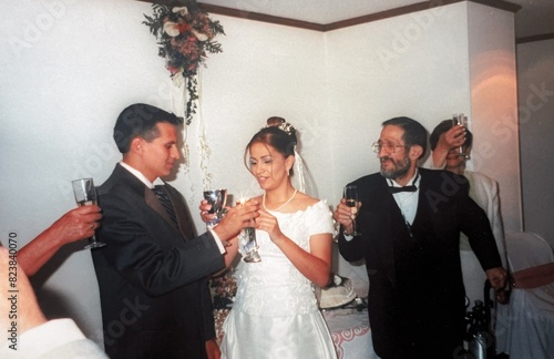 Bride and groom toasting at their wedding