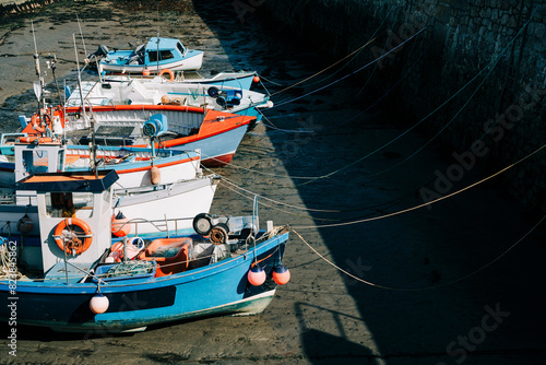 Fishing boats at low tide in Cornwall photo