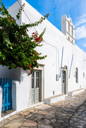 Facade of white church on street in Artemonas village  Sifnos island  Greece