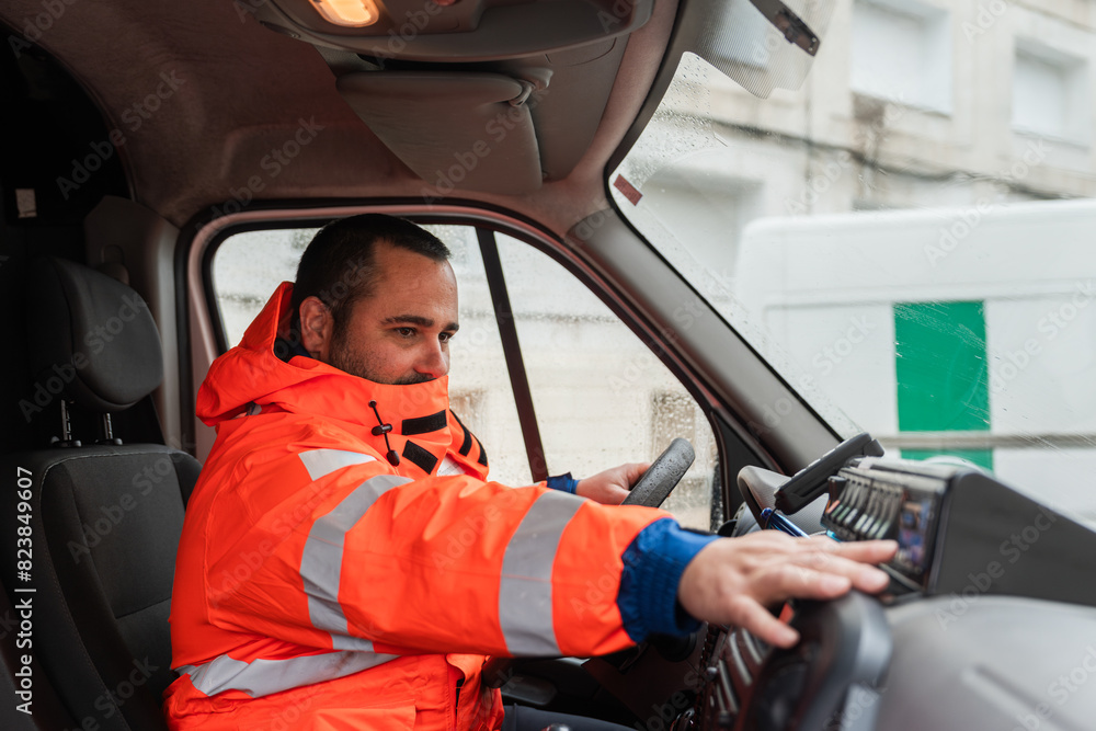 Worker Operating Ambulance in Rain Worker Operating Ambulance in Rain