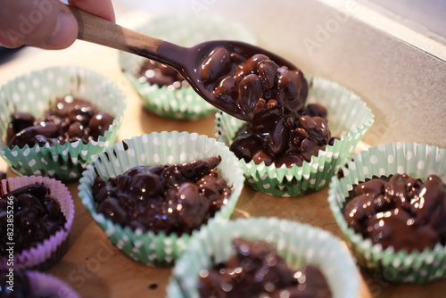 Tableau sur toile Almonds with melted dark chocolate