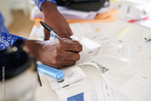 Concentrated Businessman Reviewing Financial Documents photo