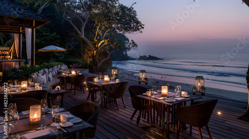 Wallpaper Mural An elegant dining setup on a beachside deck at twilight, featuring candlelit tables with a serene view of the ocean, creating a romantic and tranquil atmosphere. Torontodigital.ca