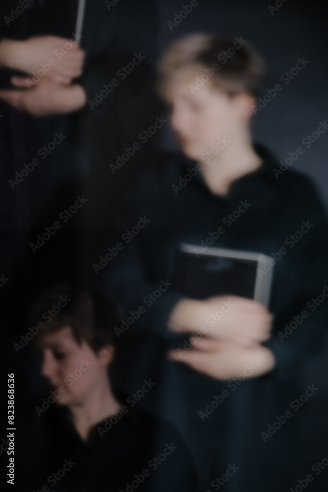 A self-portrait of a woman standing against a dark background.
A self-portrait of a woman standing against a dark background.
