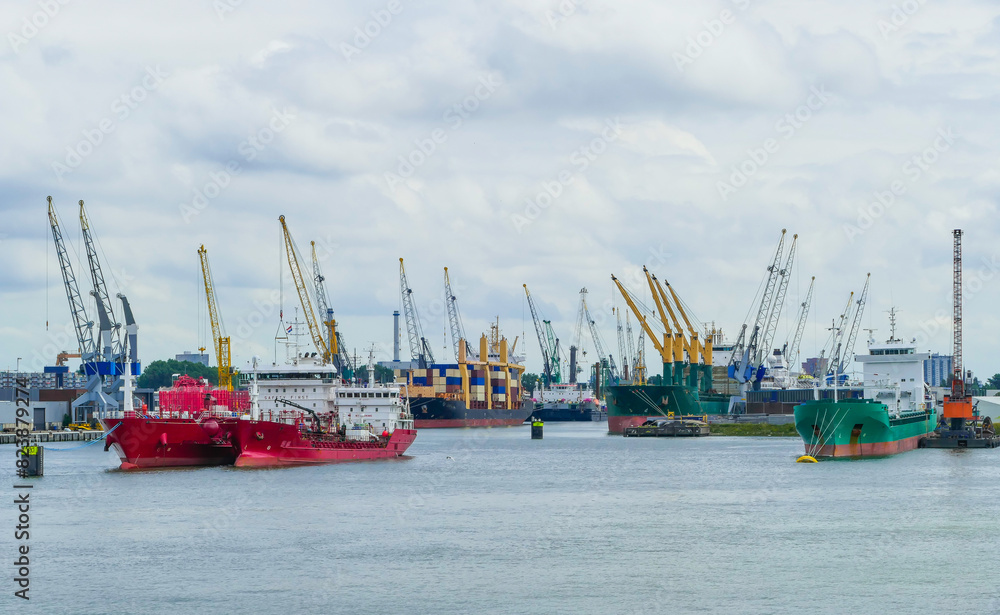 Freight Ships and Cranes in Port of Rotterdam Netherlands Freight Ships and Cranes in Port of Rotterdam Netherlands