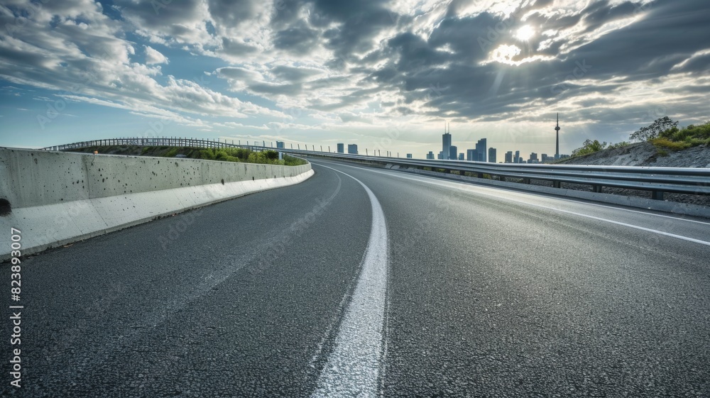 curved asphalt highway road and city skyline afternoon light. curved asphalt highway road and city skyline afternoon light.