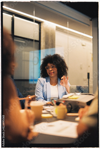 Modern businesswoman talking at meeting room photo
