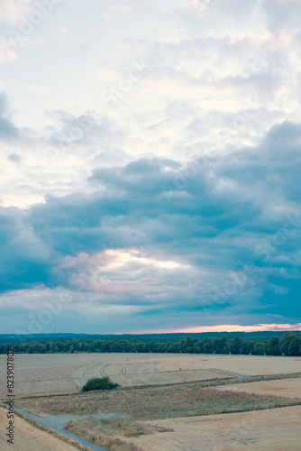 sunset view of clouds over a field in summer