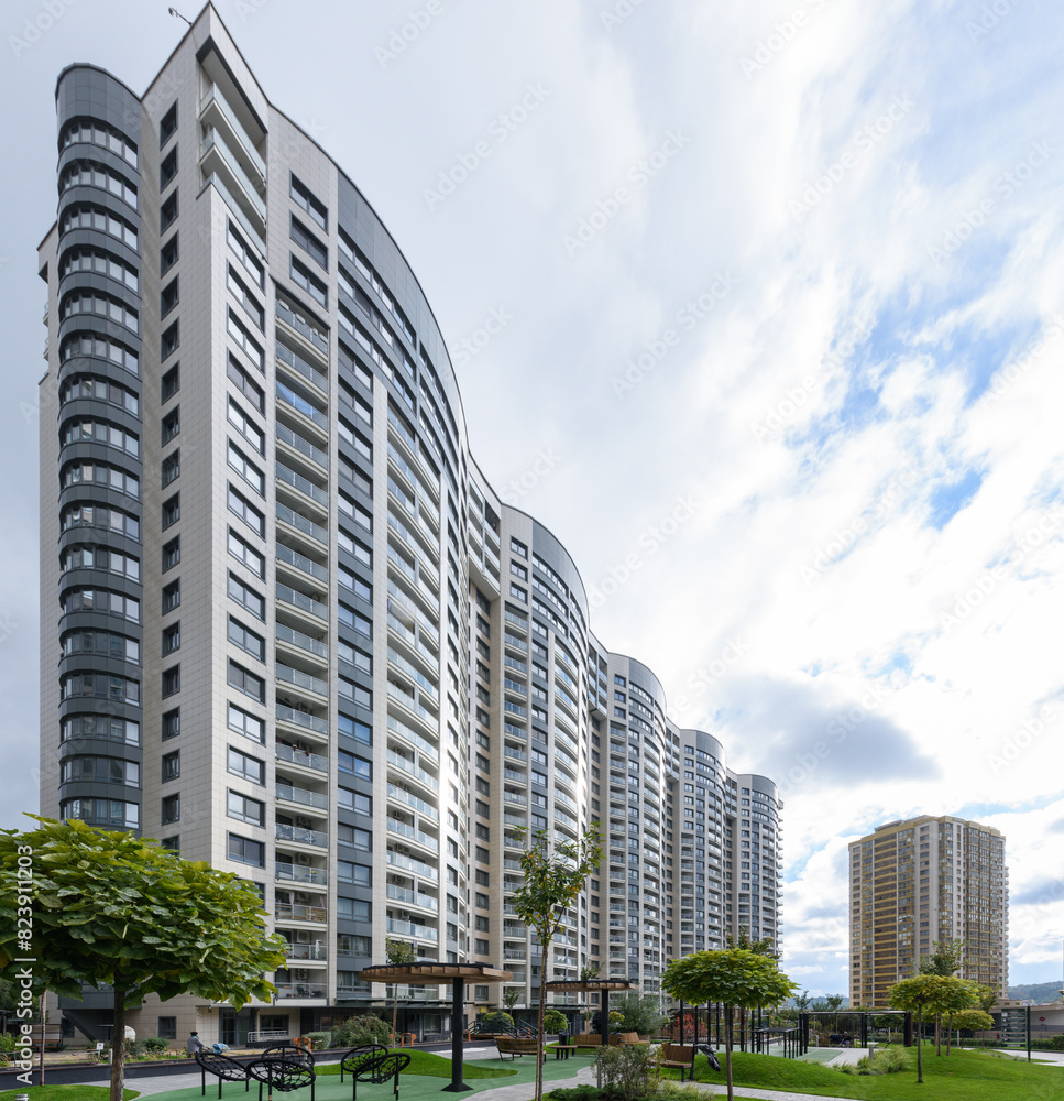 Modern highrise residential buildings against a blue sky in the urban landscape Modern highrise residential buildings against a blue sky in the urban landscape