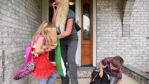 A mother is stressed and leaving the house with kids and school supplies for a back-to-school schedule or time concept.