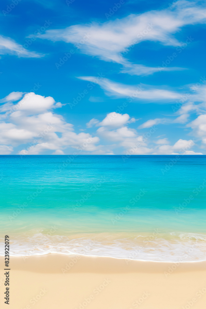 Beach with surfboard in the sand and blue sky with clouds