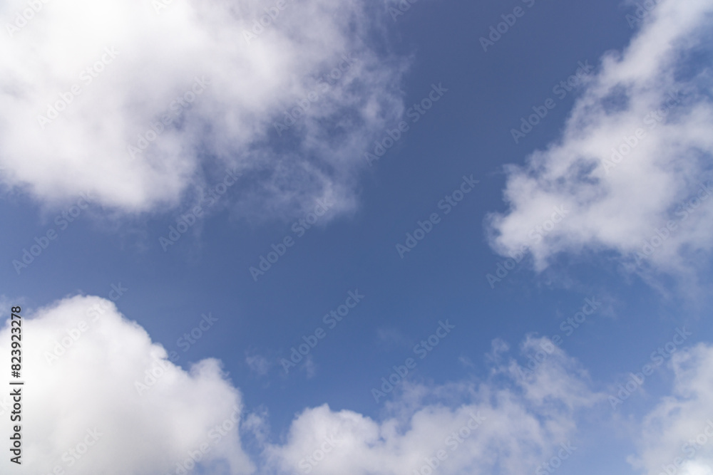 White clouds in a clear blue sky. White clouds in a clear blue sky.