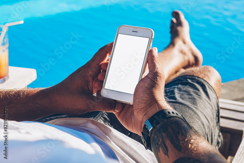 Картината върху платно Cropped image of male blogger holding modern smartphone with blank copy space sc