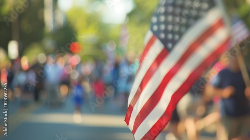 american flag leading fourth of july parade community celebration of national pride blurred