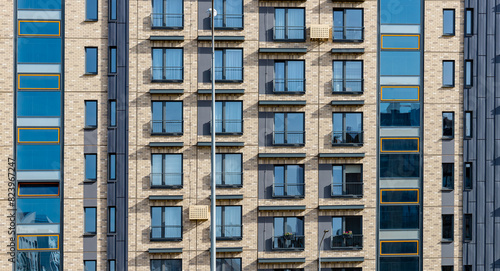 Modern apartment building. Residential condo house, exterior architecture new city home. Living block flat window balcony, luxury facade estate property urban high tower. Contemporary rental town
