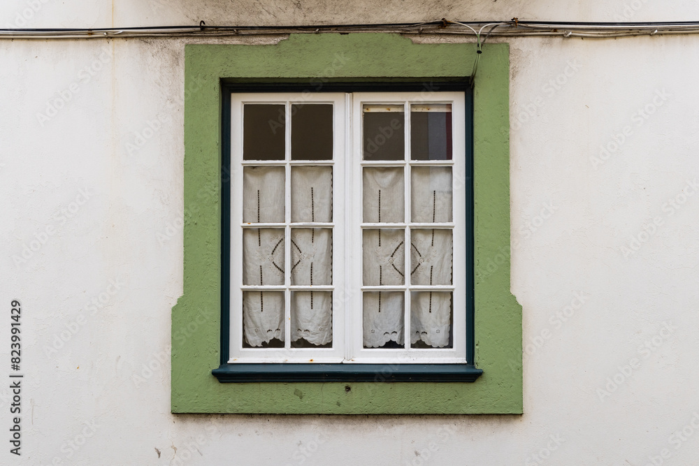 Green framed window on a building in Angra do Heroismo.