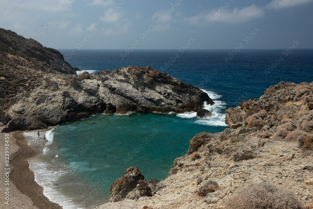Wild rocky coast with picturesque cove at the famous Nas beach, Ikaria, Greek Islands Wild rocky coast with picturesque cove at the famous Nas beach, Ikaria, Greek Islands