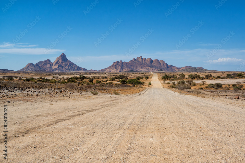 The Spitzkoppe in the desert. A group of bald granite peaks between Usakos and Swakopmund in the Namib desert of Namibia in the late afternoon. It is  The Spitzkoppe.