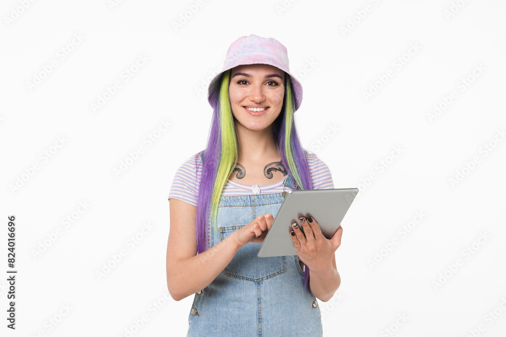 Happy young teenage woman girl hipster using digital tablet looking at camera online for e-learning e-commerce, remote work, surfing social media isolated in white background Happy young teenage woman girl hipster using digital tablet looking at camera online for e-learning e-commerce, remote work, surfing social media isolated in white background