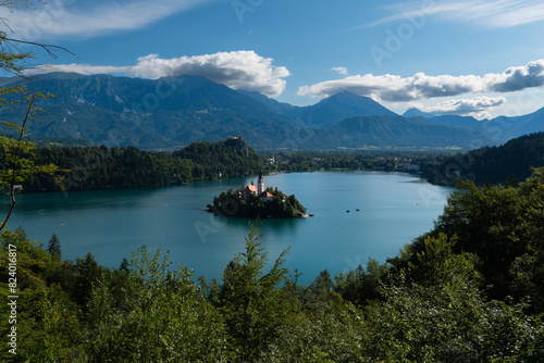 The famous and beautiful lake Bled with it’s signature small Bled Island with in the background Bled Castle on the high cliff, Bled, Slovenia photo