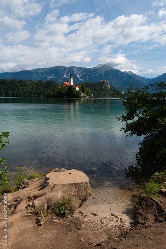 The famous and beautiful lake Bled with it’s signature small Bled Island with in the background Bled Castle on the high cliff, Bled, Slovenia photo