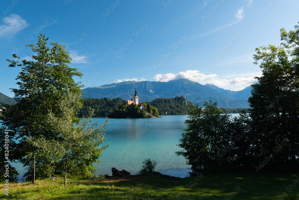 Fototapeta premium The famous and beautiful lake Bled with it’s signature small Bled Island with in the background Bled Castle on the high cliff, Bled, Slovenia