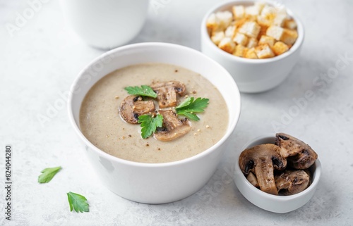 Mushroom cream soup with parsley in a bowl