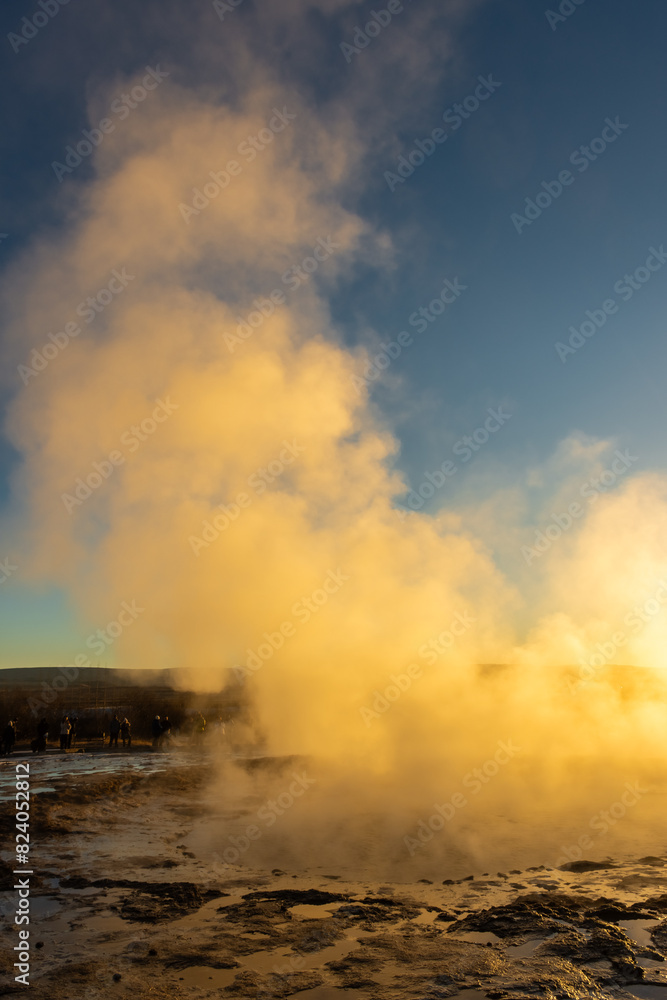 Fototapeta premium Stokkur geyser spectacular eruption in front of the sun , Iceland