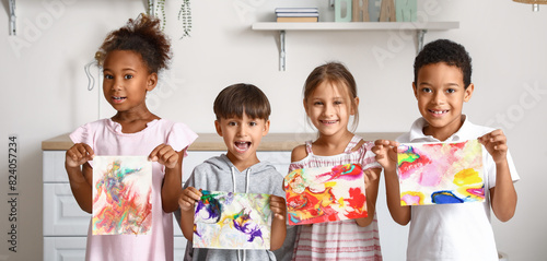 Little children with painti...