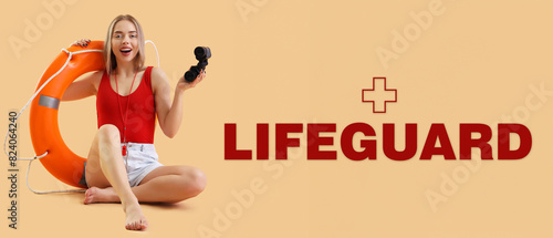 Female lifeguard with binoc...