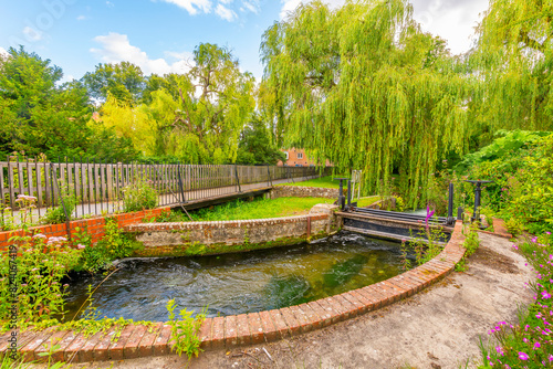 View from The Weirs, a picturesque waterfront walking path along the river Itchen through a parklike area of the medieval town of Winchester, England. photo