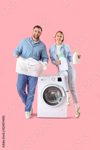 Young couple doing laundry ...