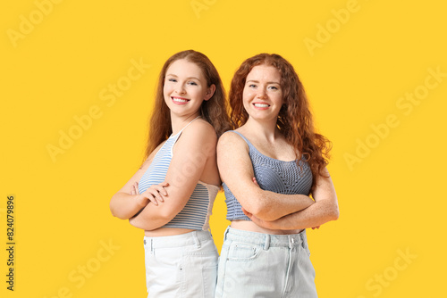 Happy redhead sisters on ye...