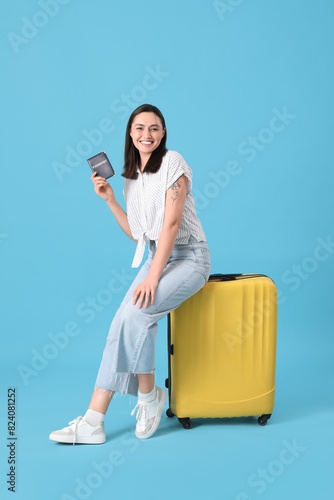 Female tourist with suitcas...