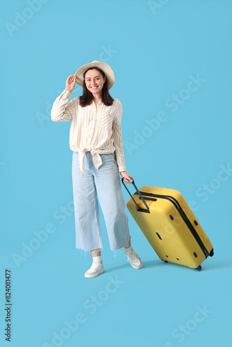 Female tourist with suitcas...