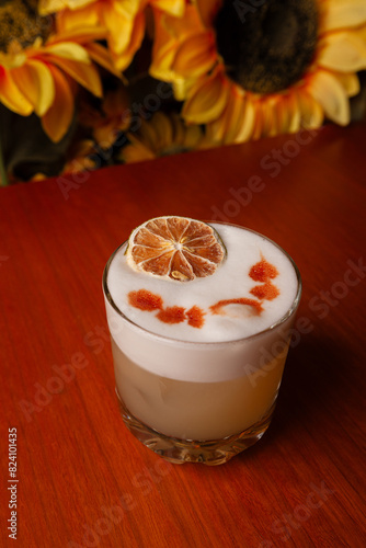 Variety of cocktails in an elegant bar decorated with bottles and sunflowers.  photo