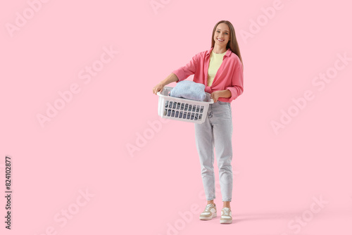 Young woman holding basket ...