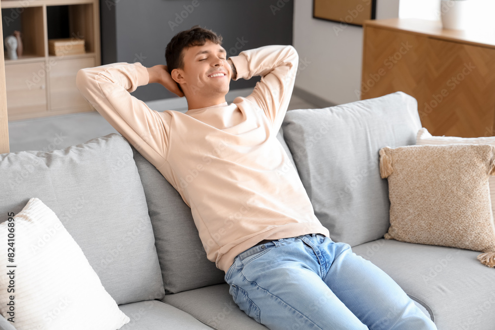Young man resting on sofa at home Young man resting on sofa at home