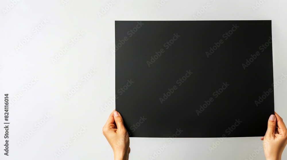 holding balck paper white backgrond