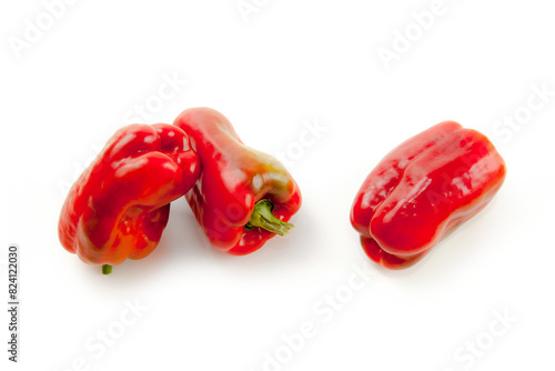 Three red bell pepper isolated on white background with clipping path. .