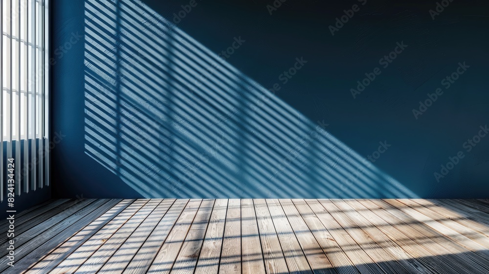 A room with a blue wall and wooden floor. The room is empty and has a lot of natural light coming in through the window A room with a blue wall and wooden floor. The room is empty and has a lot of natural light coming in through the window