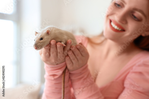 Young woman with cute rat a...