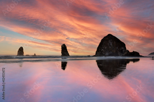 USA, Oregon. Cannon Beach and Haystack Rock at sunset and low tide photo