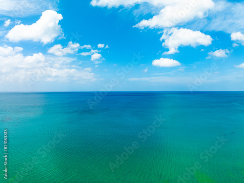 Aerial view of a blue sea surface water texture background Sun reflections over ocean  Aerial flying drone view Waves water surface texture on sunny tropical ocean in Phuket island Thailand