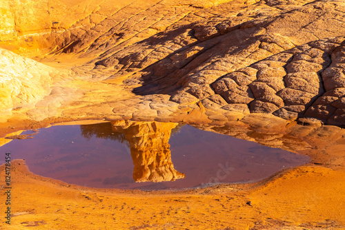 USA, Utah, Grand Staircase Escalante National Monument. Pothole filled with water after rain. photo