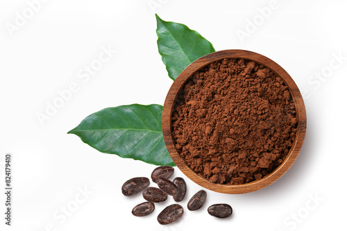 Cocoa powder in wooden bowl with cocoa beans and leaves isolated on white background . Top view