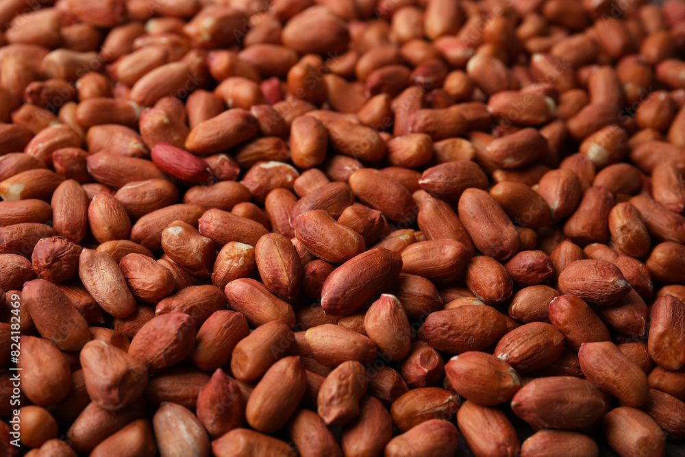 Many fresh unpeeled peanuts as background, closeup Many fresh unpeeled peanuts as background, closeup
