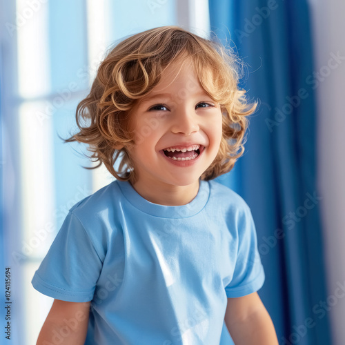 portrait of a young individual in blue with obscured face against a blurred background © Imane