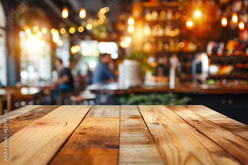 Wood table top on blurred restaurant interior background